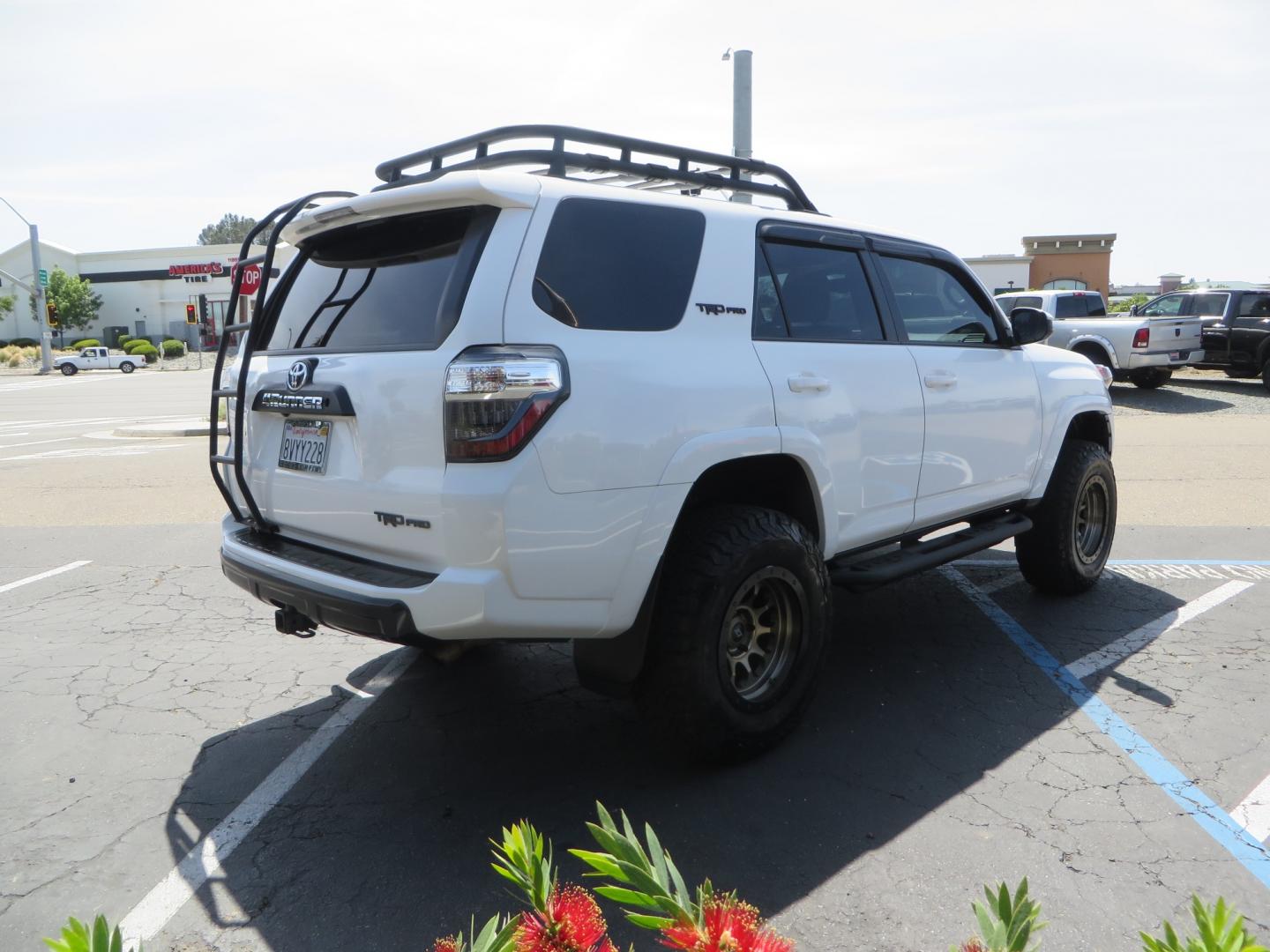 2019 White /black Toyota 4Runner TRD PRO 4WD (JTEBU5JR9K5) with an 4.0L V6 DOHC 24V engine, 5A transmission, located at 2630 Grass Valley Highway, Auburn, CA, 95603, (530) 508-5100, 38.937893, -121.095482 - TRD PRO 4Runner sitting on 17" SCS wheels, BFG KO2 tires, Tyger running boards, Roof Rack with ladder, and window tint. - Photo#4